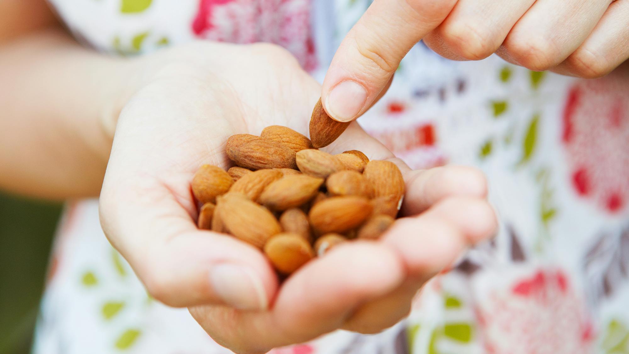 Woman snacking on nuts